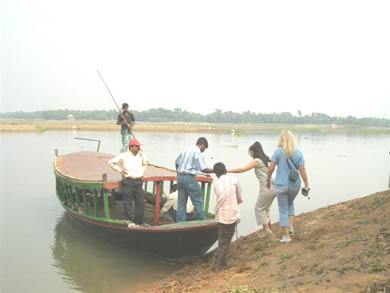 Walking to the crossing point and boarding the boat to Kulun Village