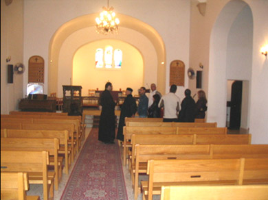 Rev. al-Kopti explaining about the Church to some participants