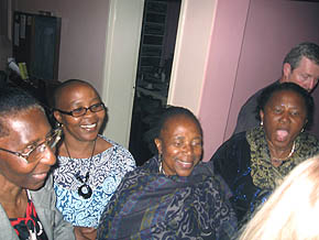 Ladies from Soweto arriving late, happy to greet Vassula at the back entrance