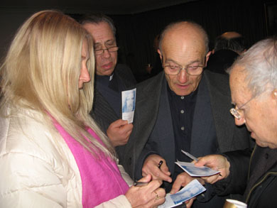 Autographing prayer cards